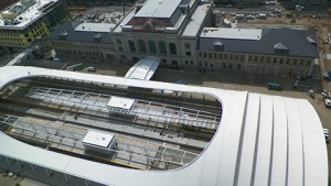 The new commuter rail "Canopy" at Denver's historic Union Station. The old station building is at the top of the photograph connected to the rail terminal by the portico shown; and to buses and light rail by facilities below the rail level.